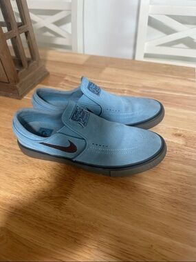 Nike women’s Slip-On Suede Loafers in Light Blue with Dark Swoosh